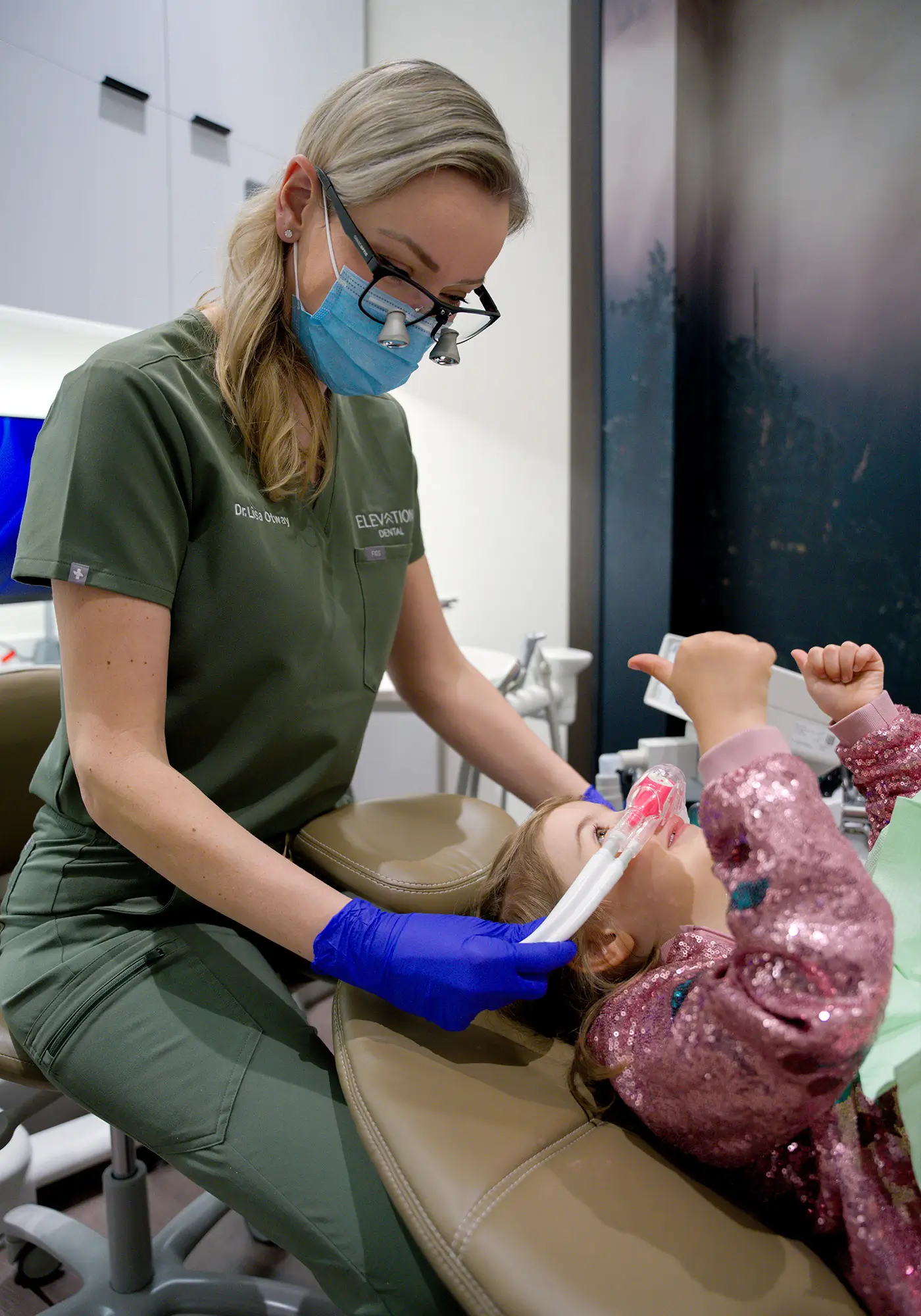 Dentist explaining model of teeth to a patient